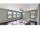 Spacious bedroom with dark hardwood floors and multiple windows at 219 E Beth Dr, Phoenix, AZ 85042