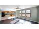 Kitchen with light wood cabinets, black appliances, and a breakfast bar at 219 E Beth Dr, Phoenix, AZ 85042