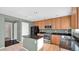 Eat-in kitchen with wood cabinets and granite counters at 219 E Beth Dr, Phoenix, AZ 85042