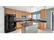 Modern kitchen with island, stainless steel appliances at 219 E Beth Dr, Phoenix, AZ 85042
