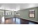 Bright living room with dark hardwood floors and neutral walls at 219 E Beth Dr, Phoenix, AZ 85042