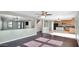 Open living room with kitchen and dark wood floors at 219 E Beth Dr, Phoenix, AZ 85042