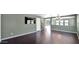 Living room with dark hardwood floors, neutral walls, and a staircase at 219 E Beth Dr, Phoenix, AZ 85042