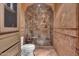 Bathroom with glass shower, toilet and built-in shelving at 2333 S Eileen Pl, Chandler, AZ 85286
