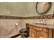 Upscale bathroom with dark vanity and decorative tile at 2333 S Eileen Pl, Chandler, AZ 85286