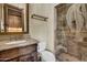 Elegant bathroom with a glass shower and stone tile at 2333 S Eileen Pl, Chandler, AZ 85286