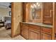 Elegant bathroom with dark wood cabinets and a granite countertop at 2333 S Eileen Pl, Chandler, AZ 85286