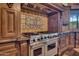 Detailed view of the kitchen's stove and custom tile backsplash at 2333 S Eileen Pl, Chandler, AZ 85286