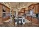 Luxury kitchen with stainless steel appliances and custom wood cabinets at 2333 S Eileen Pl, Chandler, AZ 85286
