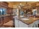 Island kitchen features granite countertops and custom wood cabinets at 2333 S Eileen Pl, Chandler, AZ 85286