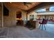 Covered patio with outdoor kitchen, grill, and bar seating at 2333 S Eileen Pl, Chandler, AZ 85286