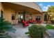 Relaxing patio area with red seating and stone flooring at 2333 S Eileen Pl, Chandler, AZ 85286