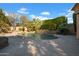 Inviting pool with a waterfall feature, flagstone patio, and lush landscaping at 2333 S Eileen Pl, Chandler, AZ 85286