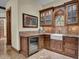 Convenient wet bar with granite countertops and a farmhouse sink at 2333 S Eileen Pl, Chandler, AZ 85286
