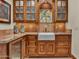Stylish wet bar offering ample storage and a built-in wine cooler at 2333 S Eileen Pl, Chandler, AZ 85286