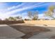 Landscaped backyard with fire pit at 24638 W Romley Rd, Buckeye, AZ 85326