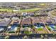 Aerial view of luxury homes, golf course and water feature, with green landscaping and swimming pools at 31023 N 117Th Dr, Peoria, AZ 85383