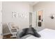 Inviting bedroom featuring a cozy rocking chair and soft neutral tones at 31023 N 117Th Dr, Peoria, AZ 85383