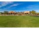 Spanish-style community clubhouse with expansive lawn at 31023 N 117Th Dr, Peoria, AZ 85383