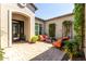 Charming courtyard with comfortable outdoor seating and lush greenery at 31023 N 117Th Dr, Peoria, AZ 85383