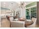 Open-concept dining area with seamless flow to the kitchen, living area and backyard at 31023 N 117Th Dr, Peoria, AZ 85383