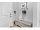 Entryway features a decorative bench with storage, artwork and key hooks at 31023 N 117Th Dr, Peoria, AZ 85383