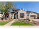 Stunning two-story home with red shutters and desert landscaping at 31023 N 117Th Dr, Peoria, AZ 85383