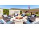 Inviting fire pit area with comfortable seating for outdoor gatherings at 31023 N 117Th Dr, Peoria, AZ 85383