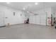 Spacious two car garage features epoxy flooring at 31023 N 117Th Dr, Peoria, AZ 85383