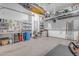 Well-organized garage with storage racks and epoxy flooring at 31023 N 117Th Dr, Peoria, AZ 85383