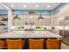 Large kitchen island with seating, pendant lighting, and full view of the spacious gourmet kitchen at 31023 N 117Th Dr, Peoria, AZ 85383