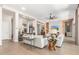 Open-concept living room showcasing hardwood floors and seamless flow into other living areas at 31023 N 117Th Dr, Peoria, AZ 85383