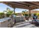Modern outdoor kitchen with stainless steel appliances at 31023 N 117Th Dr, Peoria, AZ 85383