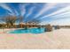 Community pool with unique features and plenty of lounge space at 31023 N 117Th Dr, Peoria, AZ 85383