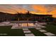 Stunning sunset view over a luxurious pool at 31023 N 117Th Dr, Peoria, AZ 85383