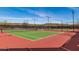 Well-maintained tennis courts with red and green surfaces at 31023 N 117Th Dr, Peoria, AZ 85383
