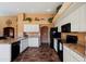 Spacious kitchen featuring ample cabinetry, corian countertops, and black appliances at 3315 W Walter Way, Phoenix, AZ 85027