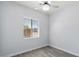 Simple bedroom with wood-look floors and a window at 35713 N 32Nd Ave, Phoenix, AZ 85086