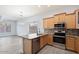 Kitchen with light wood cabinets, granite counters, and stainless steel appliances at 35713 N 32Nd Ave, Phoenix, AZ 85086