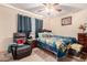 Bedroom with a queen-size bed and ceiling fan at 3601 W Solano Dr, Phoenix, AZ 85019