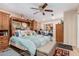 Bright bedroom with a king-size bed and ample closet space at 3601 W Solano Dr, Phoenix, AZ 85019