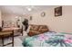 Guest bedroom with two beds, sofa, and small workspace at 3601 W Solano Dr, Phoenix, AZ 85019