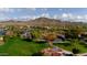 Aerial view of Anthem Del Webb community park with lake, playground, and mountains at 3766 W Jacksonville Dr, Anthem, AZ 85086