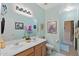 Double vanity bathroom with a large mirror and decorative art at 3766 W Jacksonville Dr, Anthem, AZ 85086