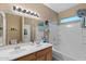 Bathroom boasts double sinks, a bathtub, and updated fixtures at 3766 W Jacksonville Dr, Anthem, AZ 85086