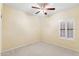 Well-lit bedroom with plantation shutters, neutral walls, and ceiling fan at 3766 W Jacksonville Dr, Anthem, AZ 85086