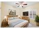 Cozy bedroom with a rustic wood bed frame, soft lighting, and plantation shutters at 3766 W Jacksonville Dr, Anthem, AZ 85086