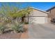 House exterior showcasing a driveway and desert landscaping at 3766 W Jacksonville Dr, Anthem, AZ 85086