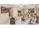 Spacious living room with dual entertainment centers and open layout into the kitchen at 3766 W Jacksonville Dr, Anthem, AZ 85086