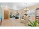 Bright living room with dining area, featuring tiled floors and a chandelier at 3766 W Jacksonville Dr, Anthem, AZ 85086